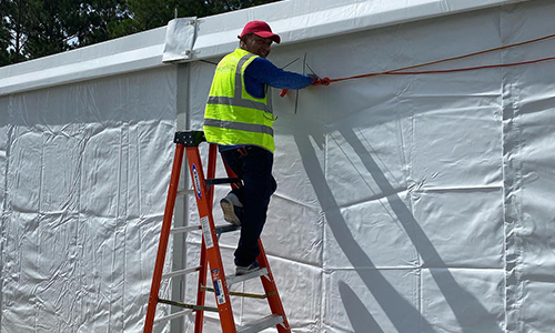 Man putting up tent