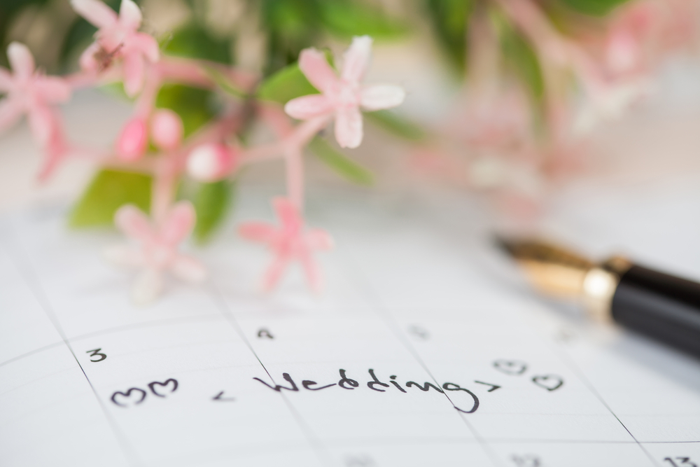 a calendar with a wedding penciled in on a date