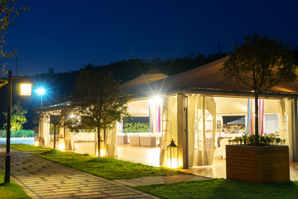 an outdoor event tent with lighting at night