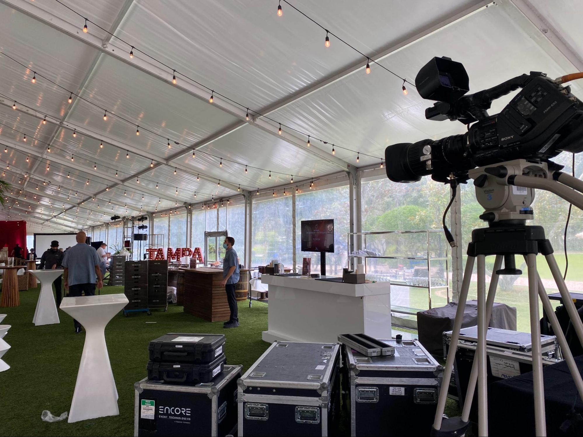 camera equipment set up near the sidewalls of the Michelin Star event tent at the Orlando Ritz Carlton