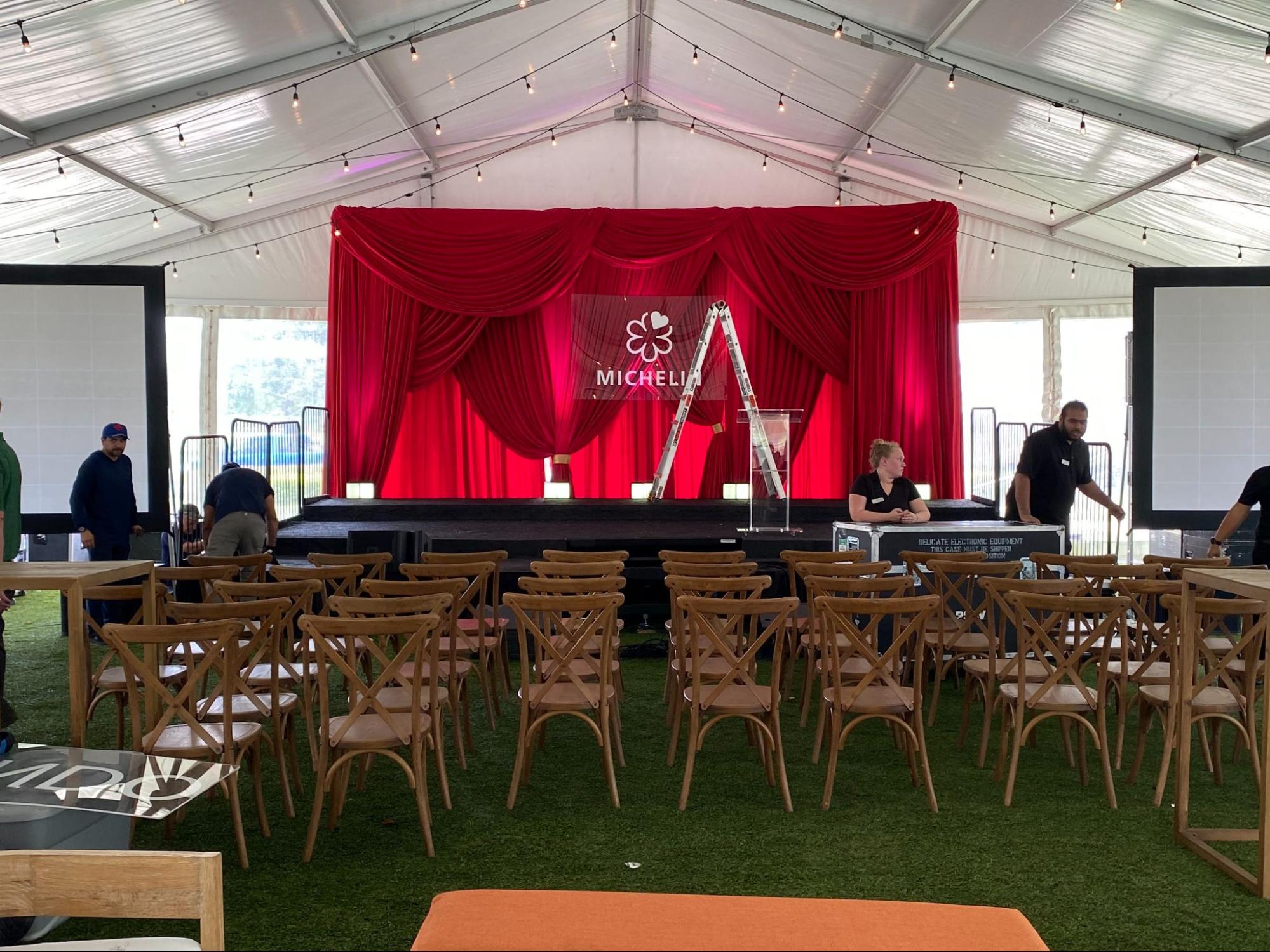 the stage set up for the Michelin Star event at the Ritz Carlton in Orlando, Florida under an event tent provided by iRentEverything