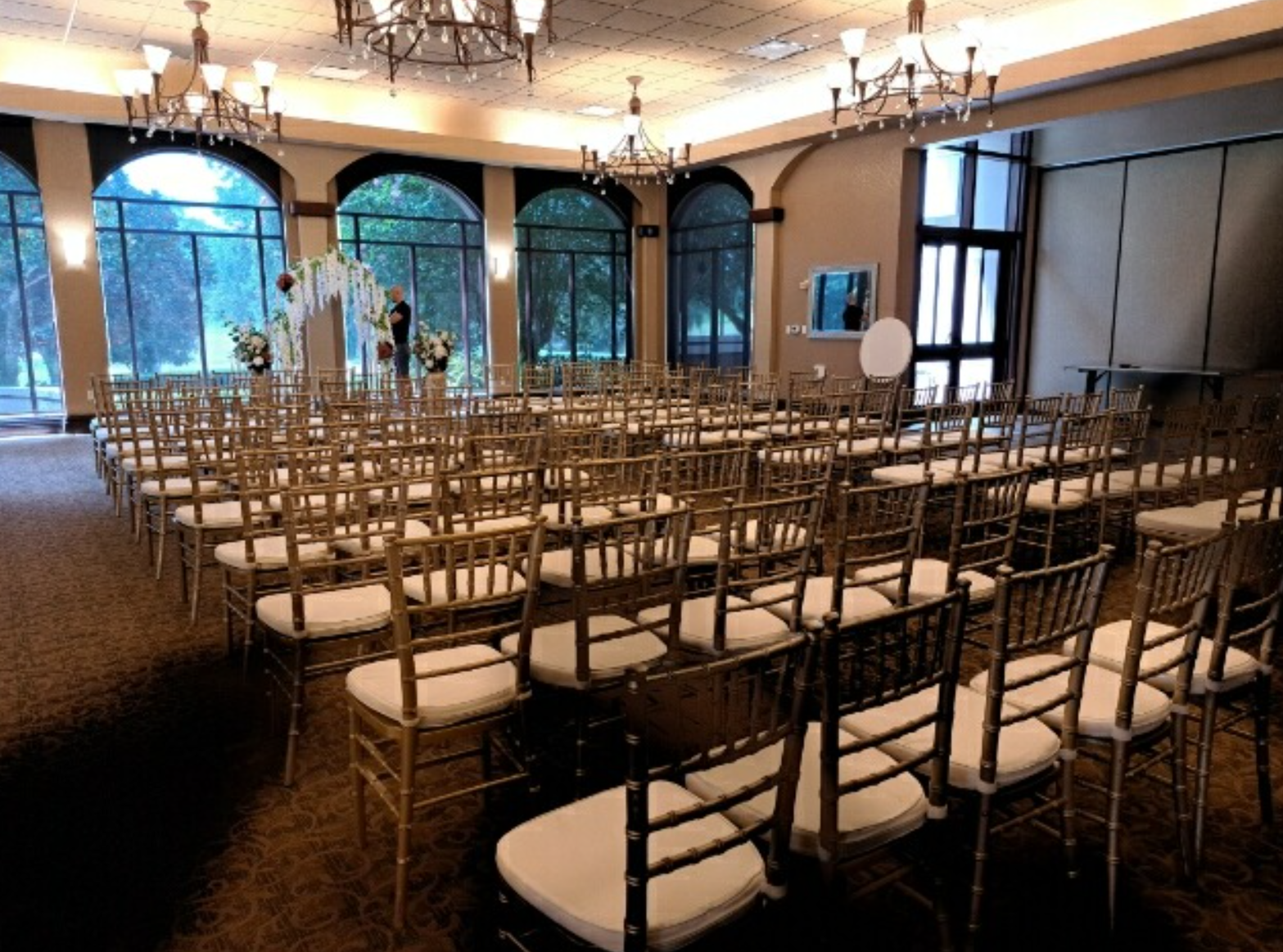 a hotel event room setup with rented chairs