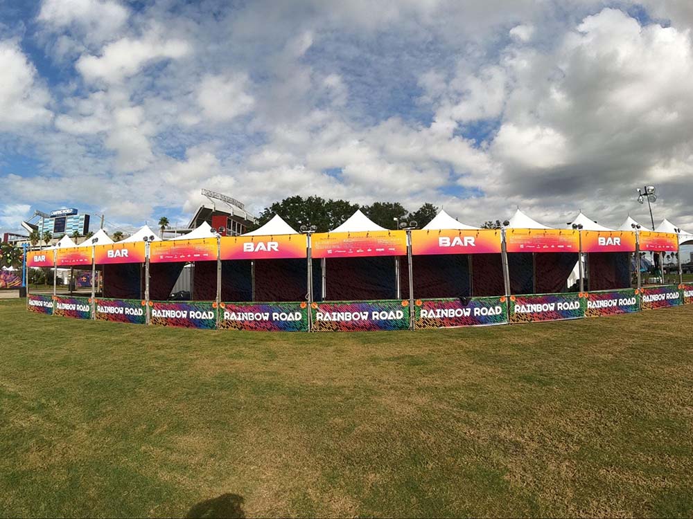 A series of colorful tents connected together with the words